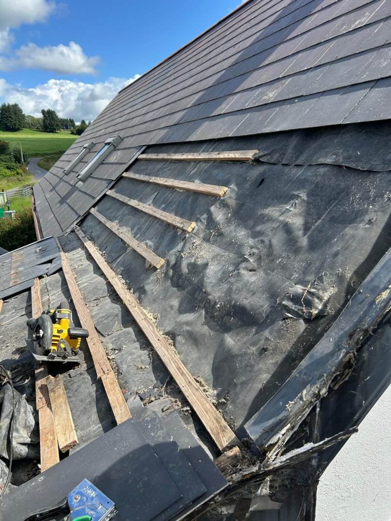 removing old underlay on a roof